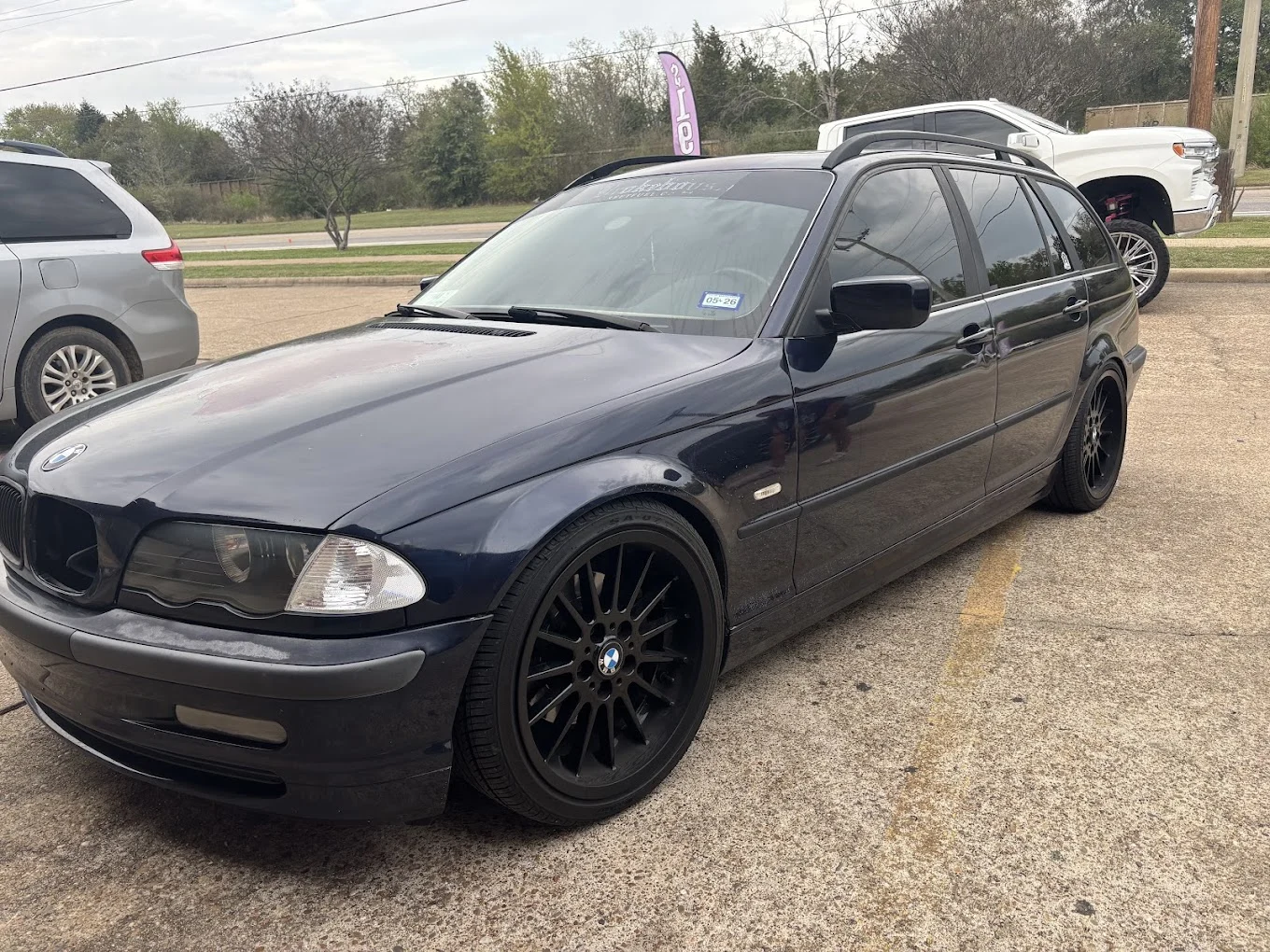 Dark blue BMW wagon with window tint, Bryan, TX